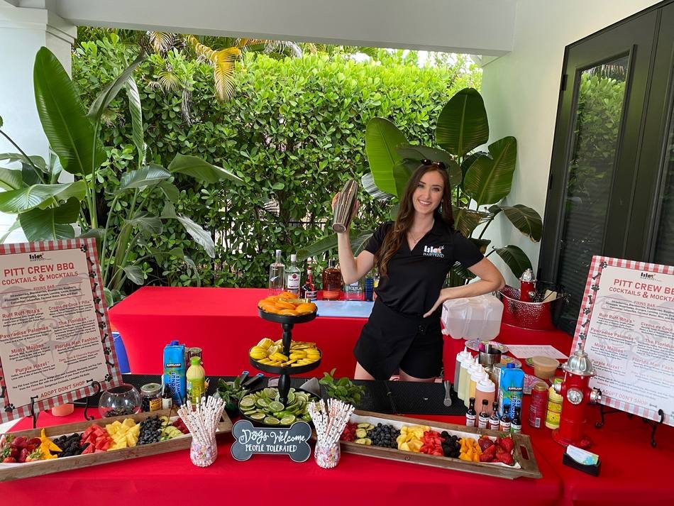 ISLE Bartend private party bar setup with fresh fruit and cocktails