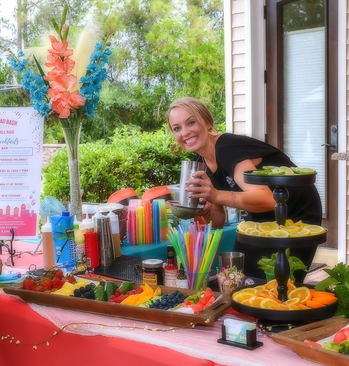 Mariel behind an abundant fresh-fruit bar