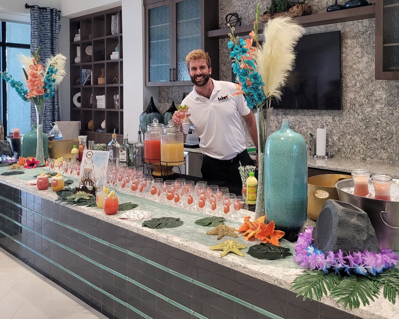 Bartender serving drinks behind a corporate event bar